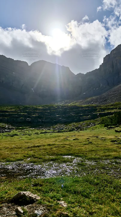 Light rays shine on Sunshine Meadows in Banff National Park - AI-generated stock image