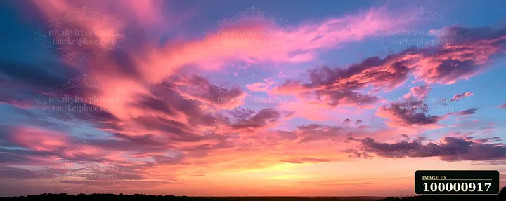 The sky shows a mix of pink, purple, and blue clouds as the sun sets, creating a vibrant scene.