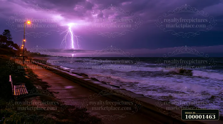 Lightning strikes over the ocean as waves crash against the coastline.