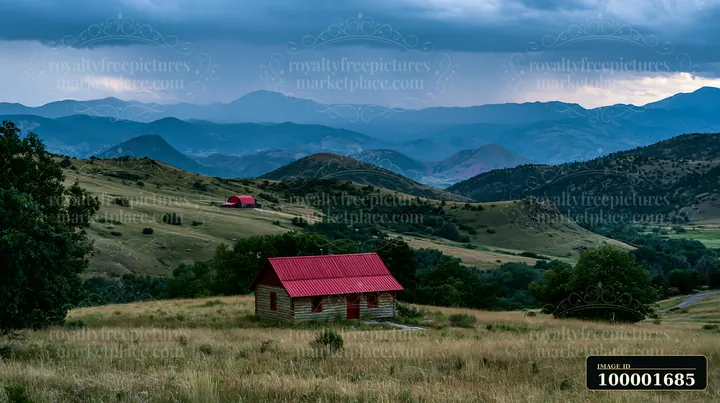 Dark clouds gather above a mountain range as a thunderstorm approaches.