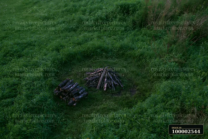 A view from above reveals a lush green meadow.