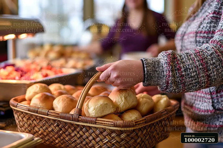 Guests at a charity event buffet select items from a large spread of food.