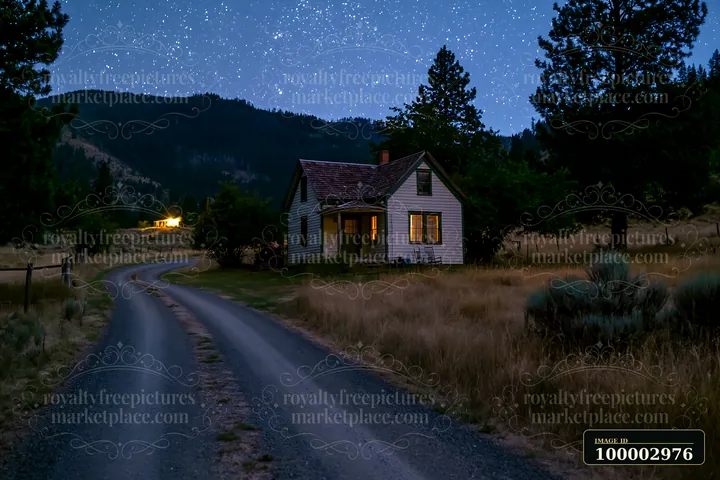 A house stands along a winding road under a clear night sky full of stars, with warm light shining from the windows.