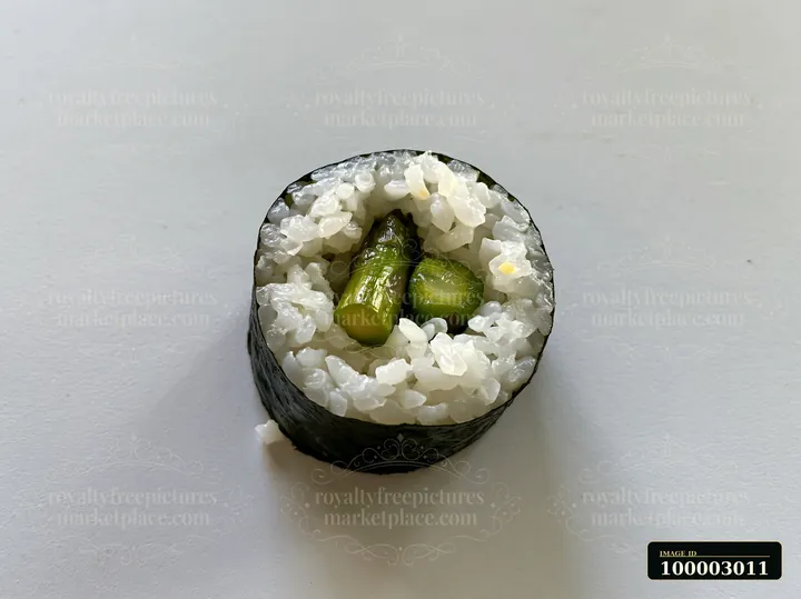 A single sushi piece rests on a plain table surface.