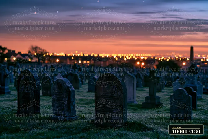 Gravestones stand in a war cemetery, while distant city lights shine under a starry sky.