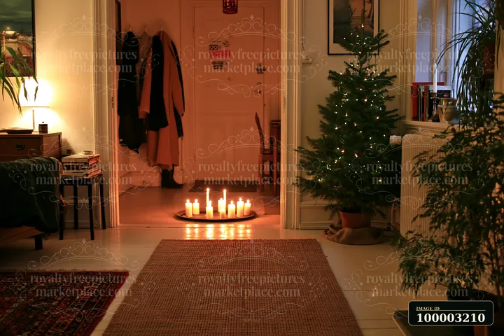 A Christmas living room with glowing candles arranged on the floor, a decorated tree in the corner, and soft lighting creating a warm atmosphere.
