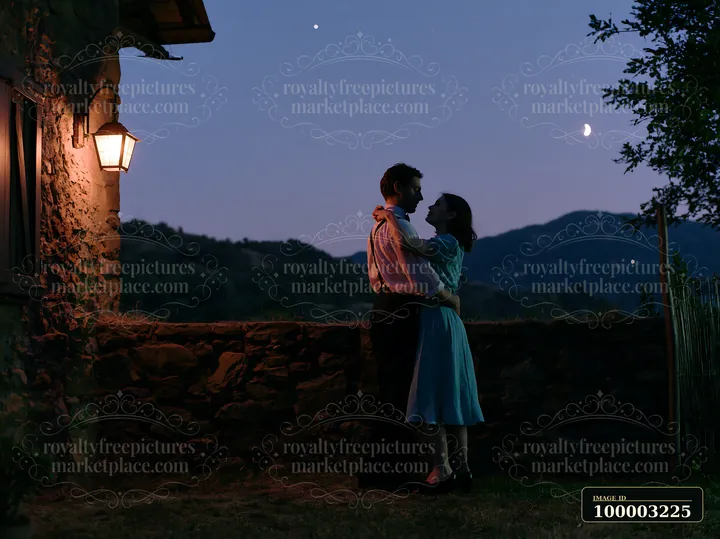 A couple dancing under stars outdoors near a rustic home in the countryside.