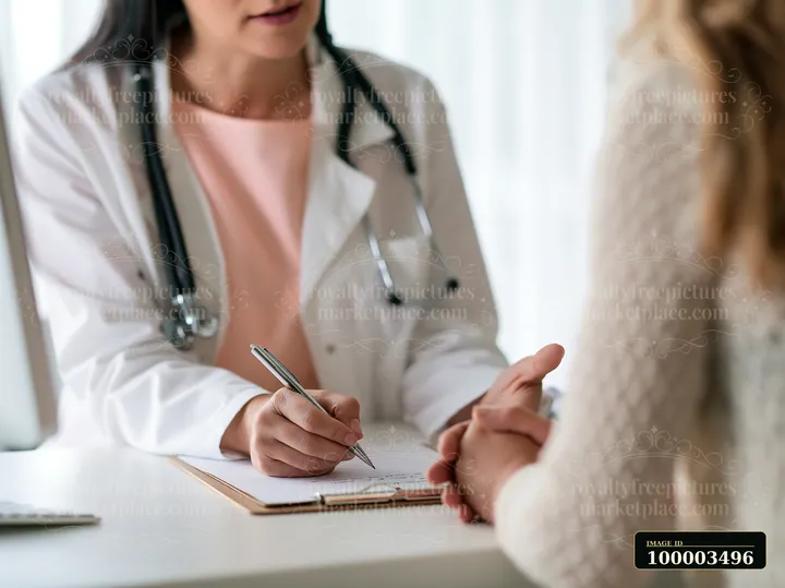 A doctor consulting with Parkinson's disease patient in a bright office.