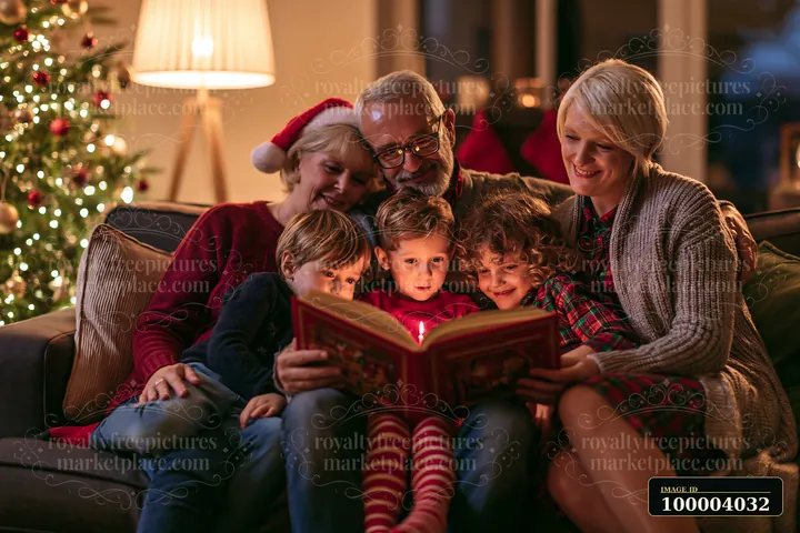 A group enjoys reading a Christmas story together in a cozy living room.
