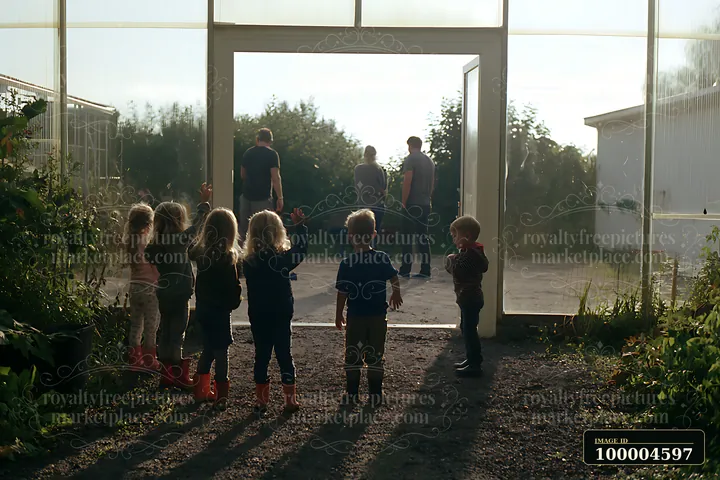 Blonde children wave toward two adults standing outside in a sunlit garden.